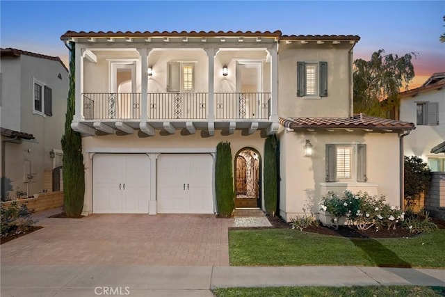 mediterranean / spanish house with a garage