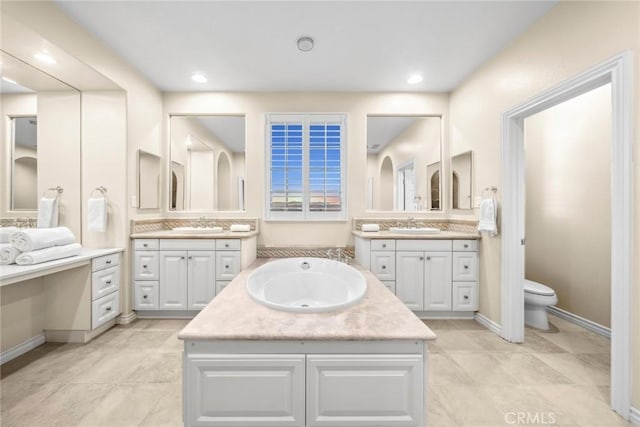 bathroom featuring tile patterned flooring, vanity, and toilet