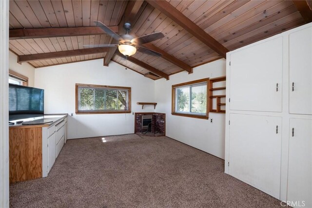 44739 Rd 619, Ahwahnee, CA 93601 - unfurnished living room with vaulted ceiling with beams, wood ceiling, carpet flooring, ceiling fan, and a fireplace