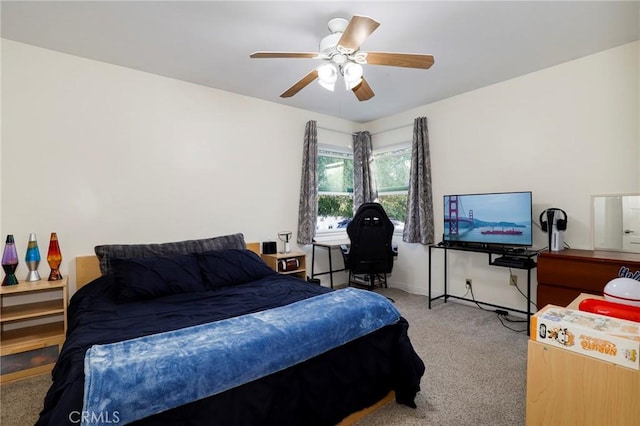 bedroom featuring light carpet and ceiling fan