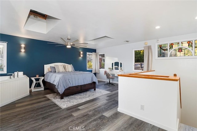 bedroom with ceiling fan and dark hardwood / wood-style flooring