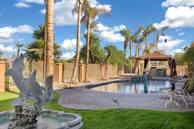 view of swimming pool with a gazebo, an in ground hot tub, a lawn, and a patio