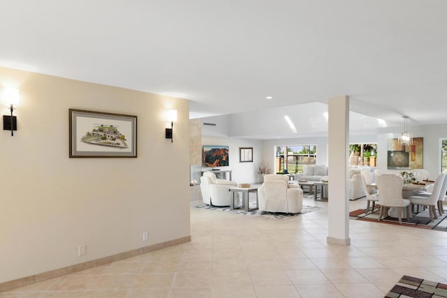 tiled living room featuring lofted ceiling