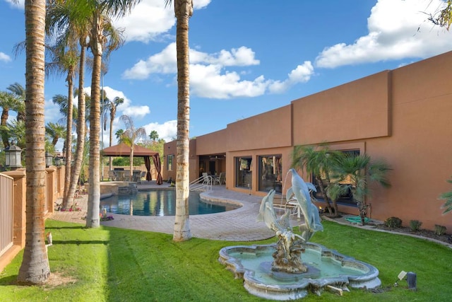 view of pool featuring a gazebo and a yard