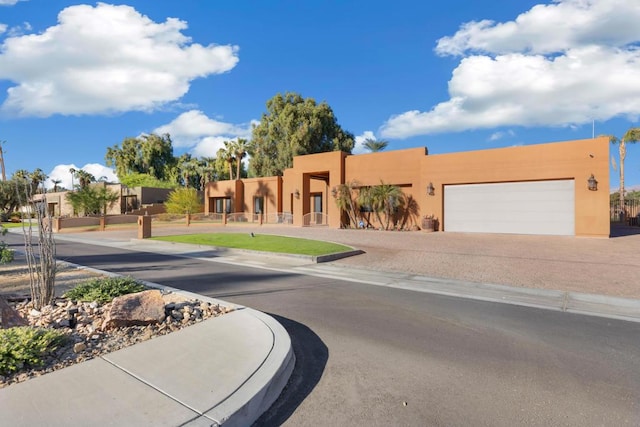 adobe home featuring a garage