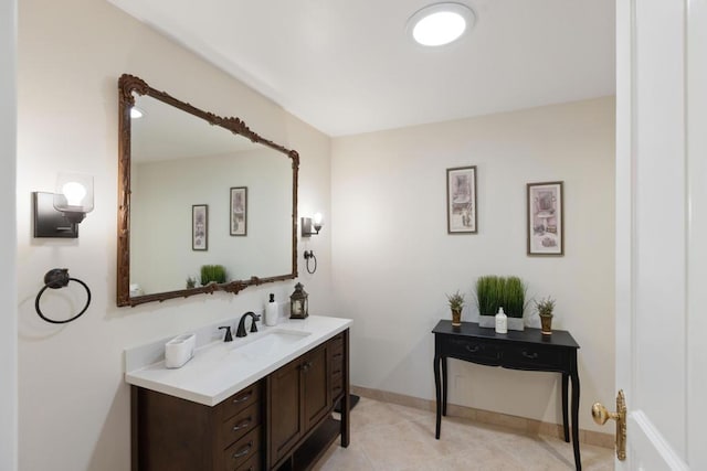 bathroom with tile patterned flooring and vanity