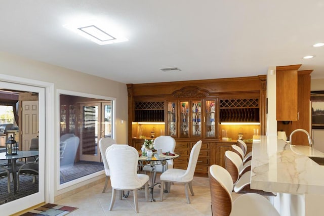 tiled dining area with sink