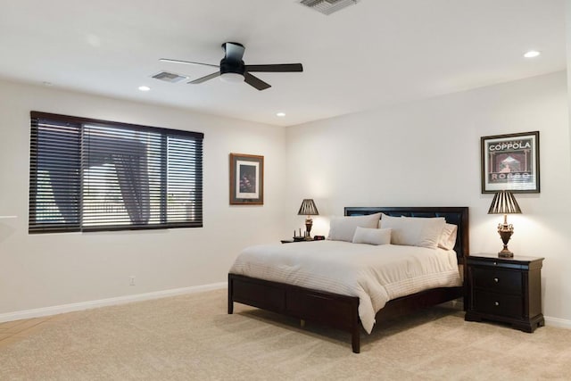 bedroom with ceiling fan and light colored carpet