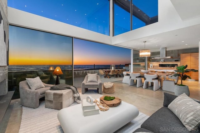 living room with a towering ceiling