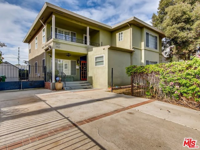 back of property with a balcony