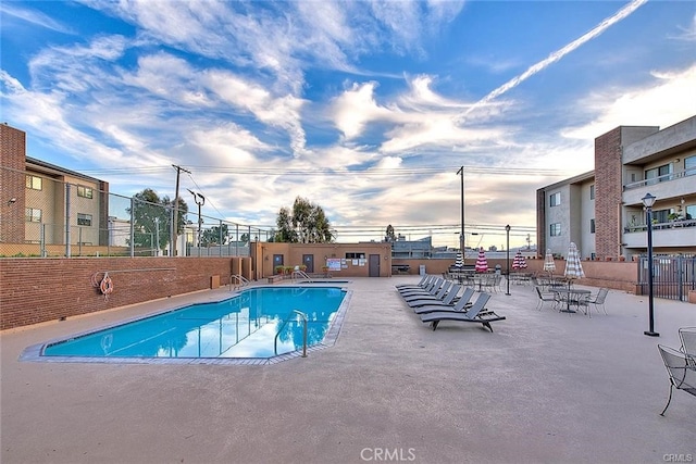 view of swimming pool featuring a patio area