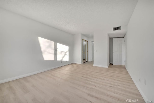 460 Oak St Unit 201, Glendale, CA 91204 - empty room featuring light wood-style flooring, baseboards, and a textured ceiling