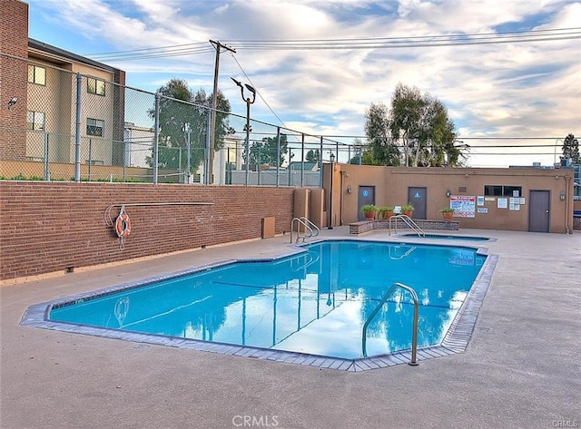 view of swimming pool with a patio area