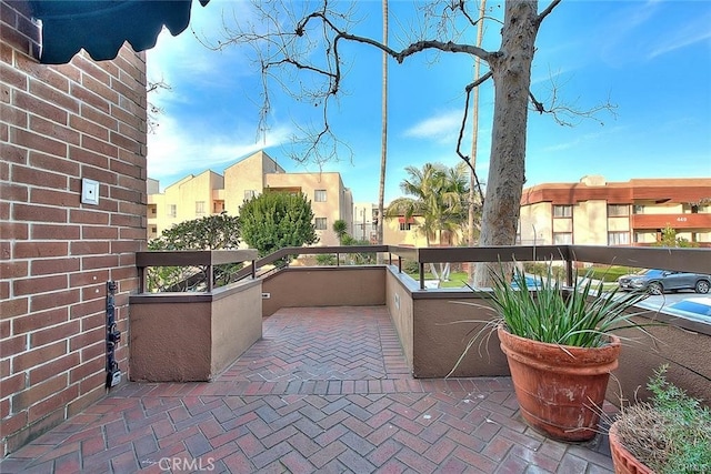 view of patio featuring a balcony