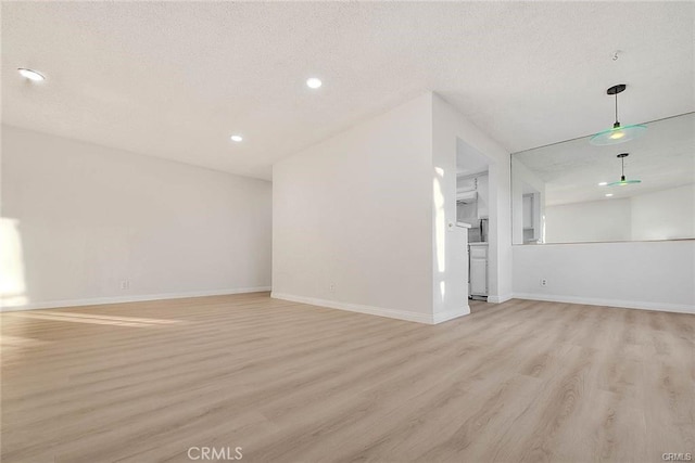 460 Oak St Unit 201, Glendale, CA 91204 - unfurnished living room with light wood-style flooring, baseboards, and recessed lighting