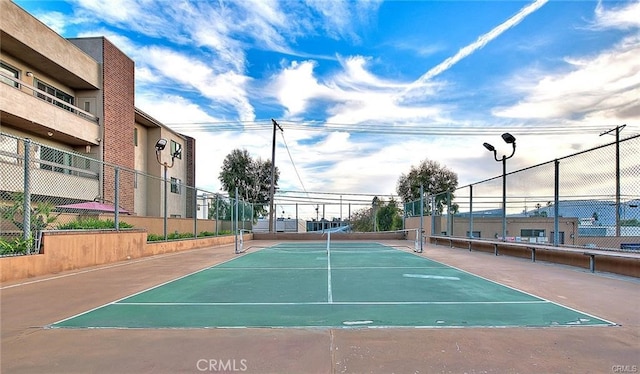 view of community with tennis court