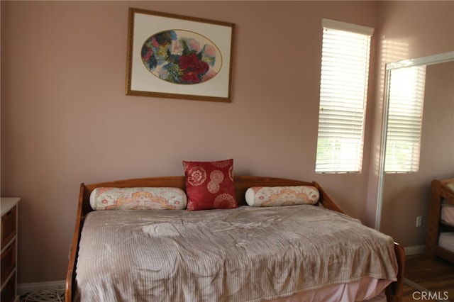 bedroom with wood-type flooring