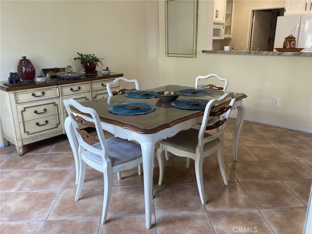 view of tiled dining room