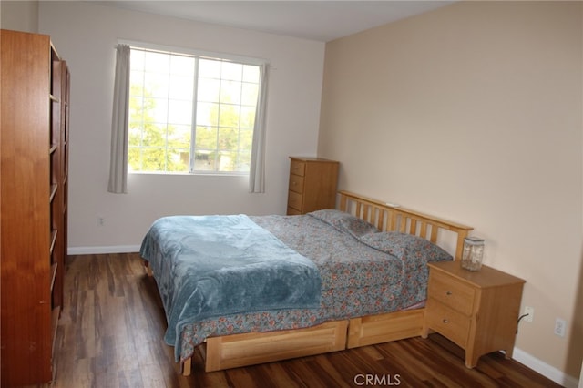 bedroom featuring dark wood-type flooring