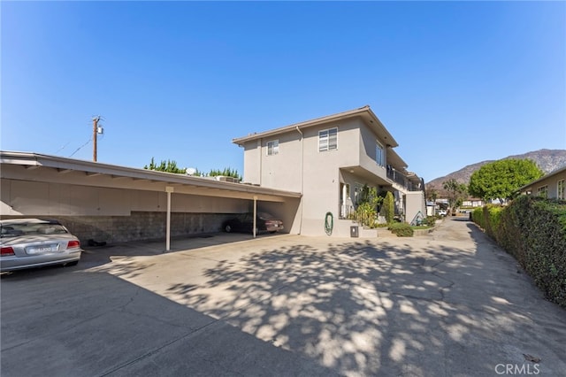 exterior space with a mountain view and a balcony