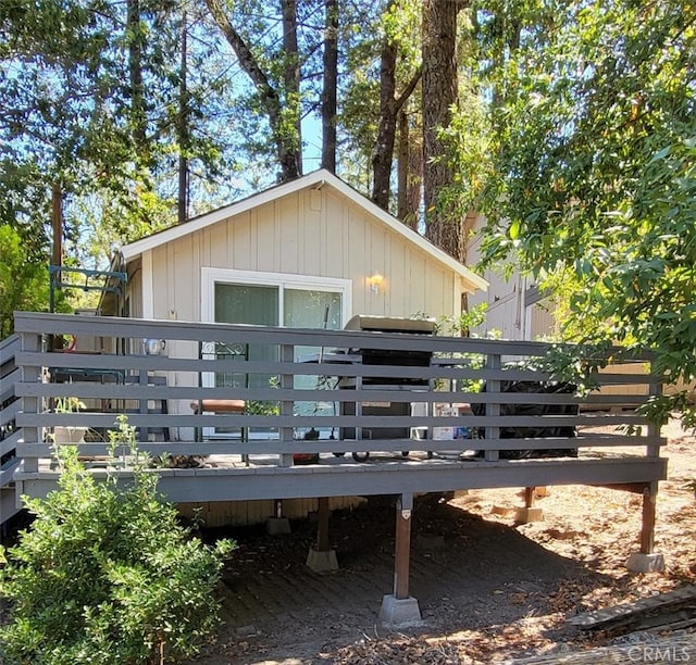 back of house featuring a deck