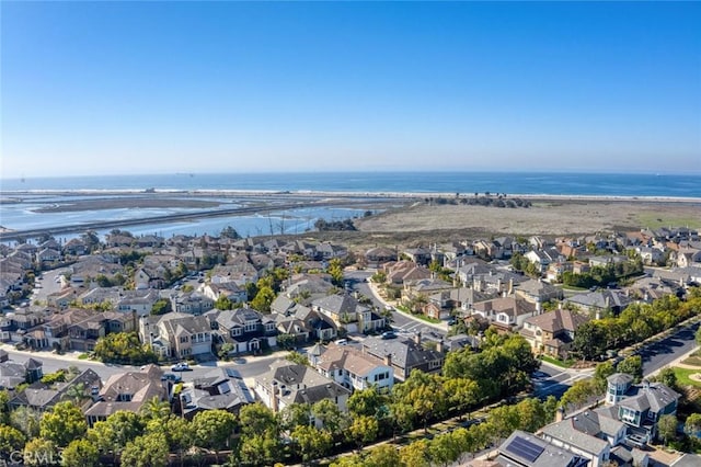 birds eye view of property featuring a water view and a residential view