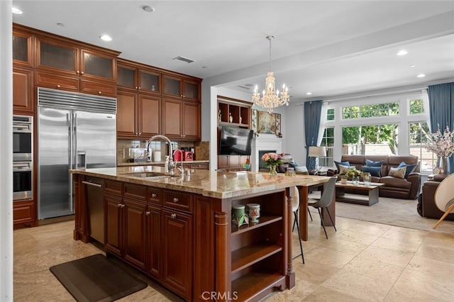 kitchen featuring a sink, visible vents, appliances with stainless steel finishes, backsplash, and open shelves