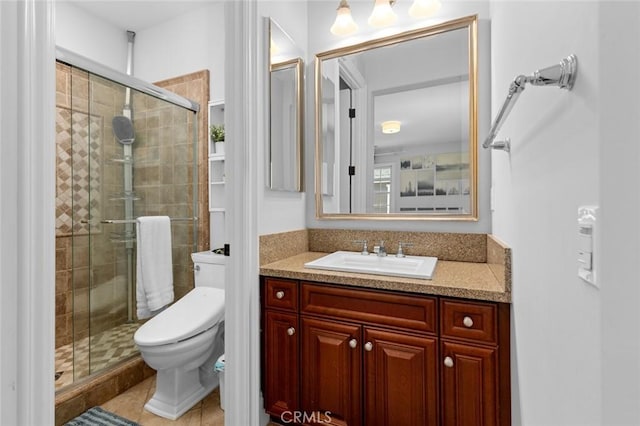 full bath with toilet, a stall shower, tile patterned floors, and vanity