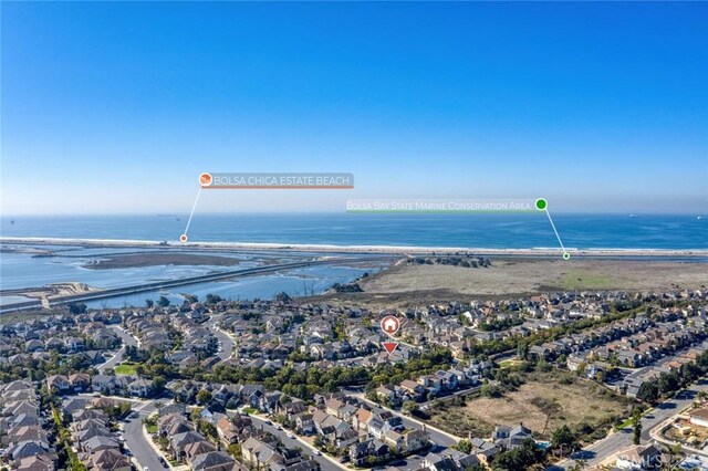 birds eye view of property featuring a water view and a residential view