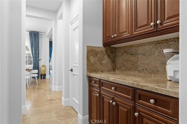 corridor featuring baseboards