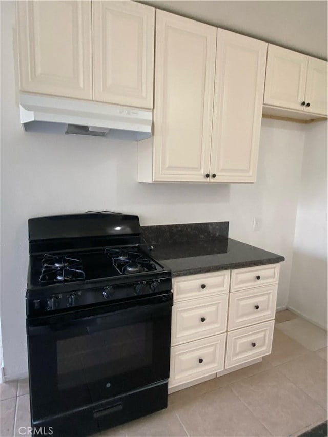 kitchen featuring white cabinets, black gas stove, and light tile patterned floors