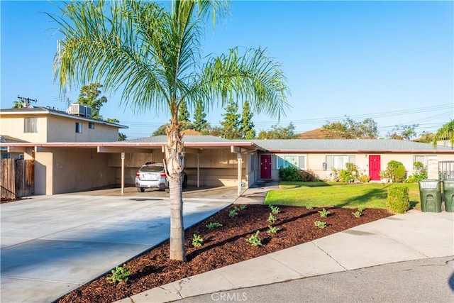 view of front of house featuring a front yard and central AC unit