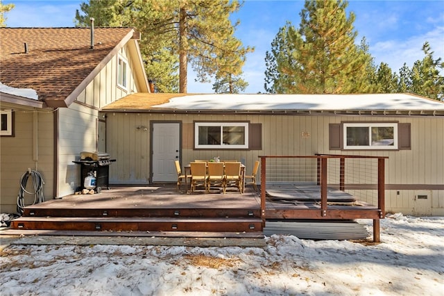 back of property featuring a deck