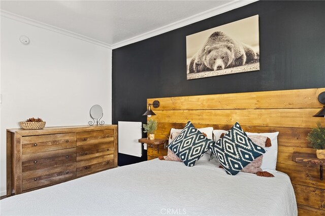 bedroom with crown molding