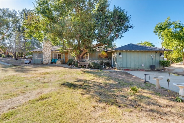 ranch-style house with a front lawn