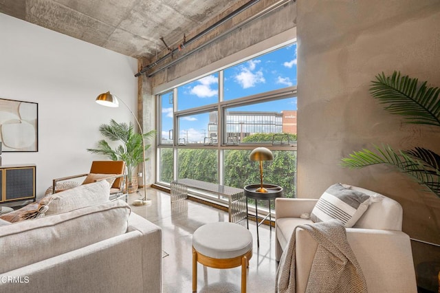 living room featuring a towering ceiling