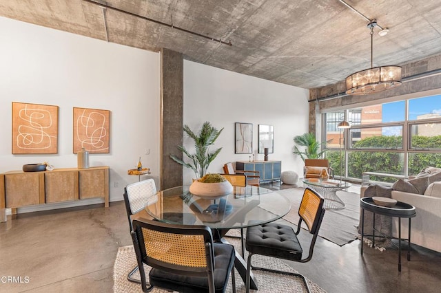 dining area featuring a notable chandelier