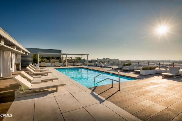 view of pool with a patio area and an outdoor living space