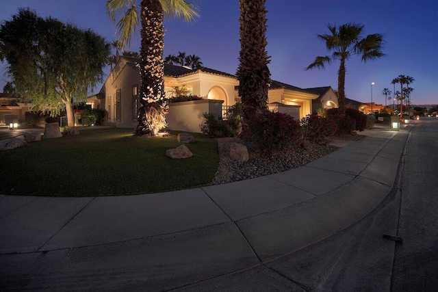 mediterranean / spanish house featuring a garage