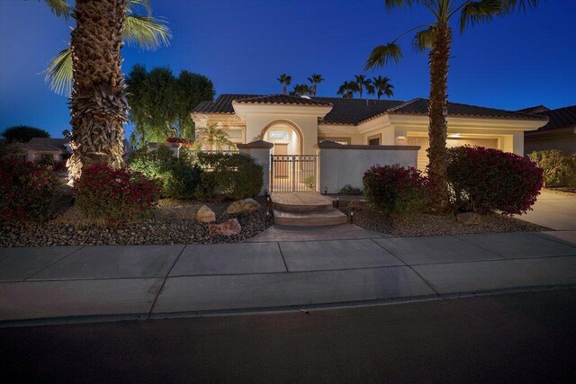 mediterranean / spanish house featuring a garage