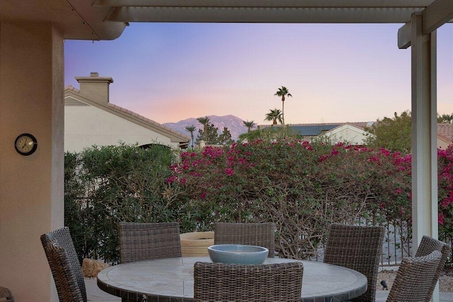 view of balcony at dusk