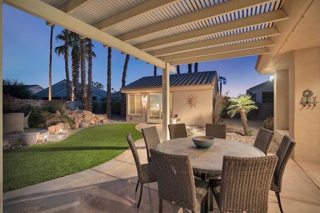 patio terrace at dusk with a yard