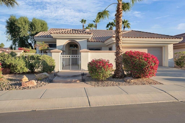 mediterranean / spanish-style home featuring a garage