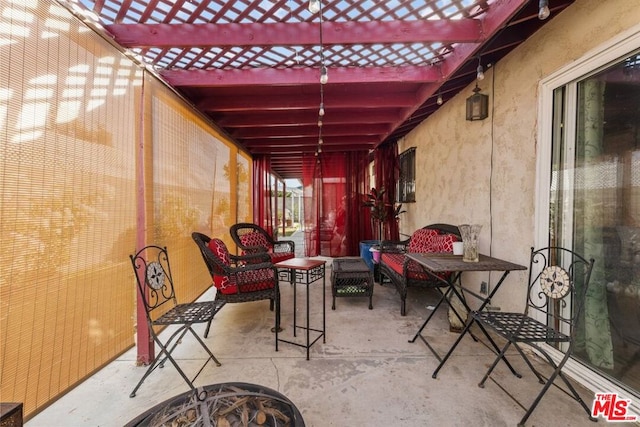 view of patio / terrace featuring a fire pit