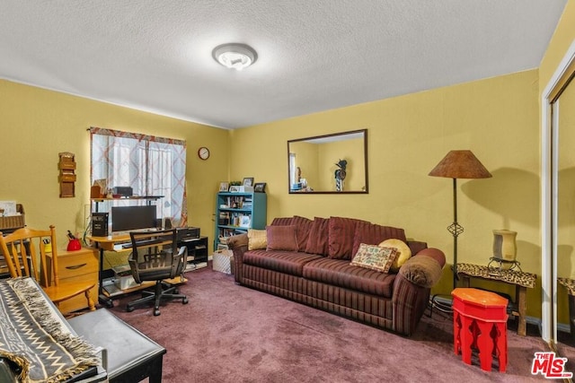 carpeted home office with a textured ceiling