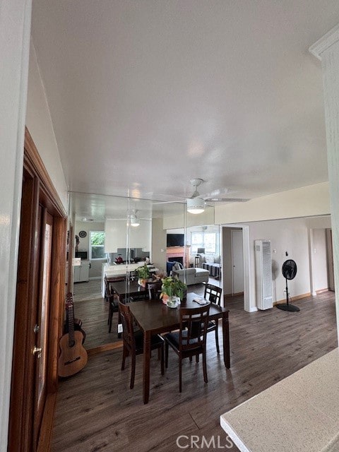 dining room featuring dark wood-type flooring and ceiling fan