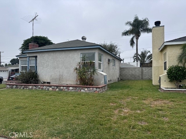 view of home's exterior with a yard