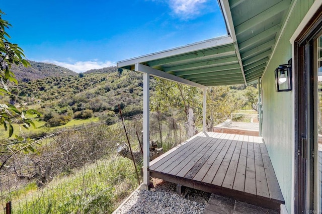 wooden terrace featuring a mountain view