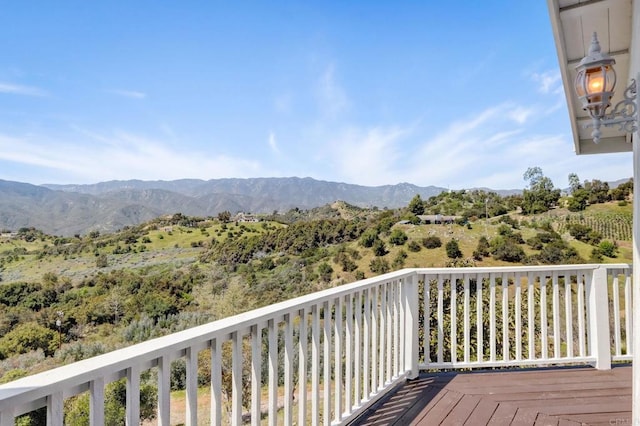 wooden terrace featuring a mountain view