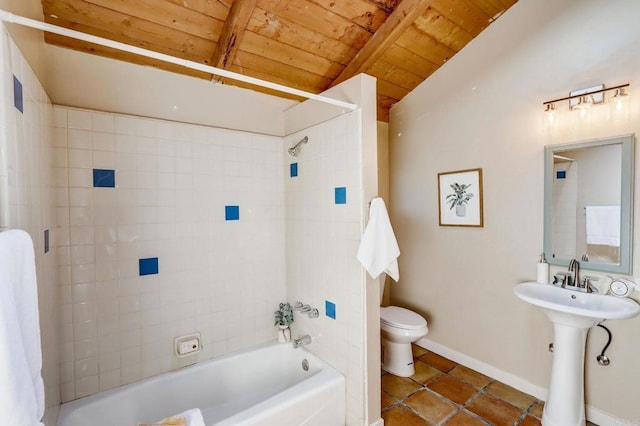 full bathroom with toilet, tiled shower / bath combo, wooden ceiling, tile patterned floors, and vaulted ceiling